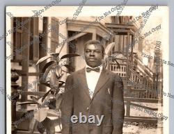 Antique RPPC portrait black man on sidewalk African American Real Photo Postcard