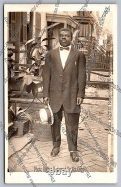 Antique RPPC portrait black man on sidewalk African American Real Photo Postcard