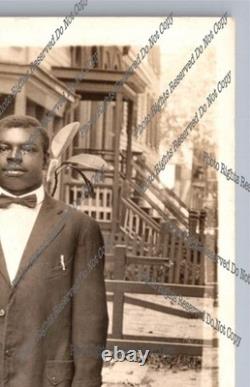 Antique RPPC portrait black man on sidewalk African American Real Photo Postcard