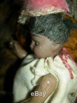 Antique dollhouse-size black bisque S & H sockethead mignonette doll withwardrobe