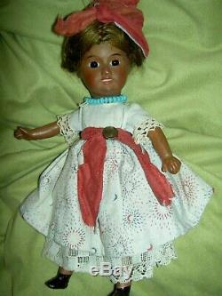 Charming antique, BROWN bisque doll, sgnd. UNIS 60 FRANCE jointed withglass eyes
