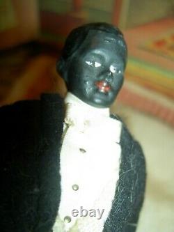 Handsome, 6 inch German, antique black bisque dollhouse doll dressed as servant