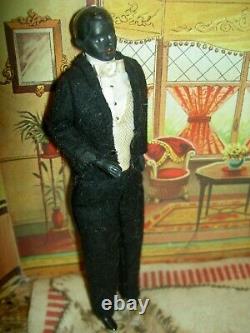 Handsome, 6 inch German, antique black bisque dollhouse doll dressed as servant