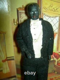 Handsome, 6 inch German, antique black bisque dollhouse doll dressed as servant