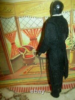 Handsome, 6 inch German, antique black bisque dollhouse doll dressed as servant