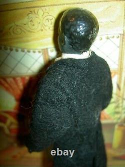 Handsome, 6 inch German, antique black bisque dollhouse doll dressed as servant