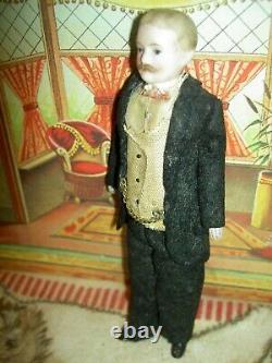 Handsome, 6 inch German, antique black bisque dollhouse doll dressed as servant