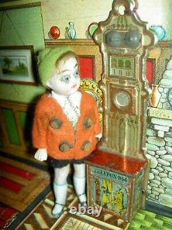 Handsome, 6 inch German, antique black bisque dollhouse doll dressed as servant