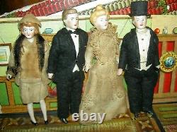Handsome, 6 inch German, antique black bisque dollhouse doll dressed as servant