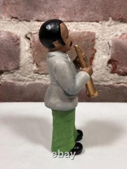 Seven Vintage Painted Porcelain Figurines of Black African American Musicians