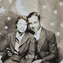 Vintage 1930's Handsome African American Couple Sitting On PaperMoon RPPC Photo