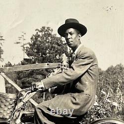 Vintage B&W Snapshot Photograph Black African American Man On Bike Smoking Pipe
